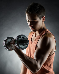 Image showing young man with dumbbell