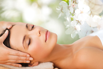 Image showing beautiful woman in spa salon having facial massage