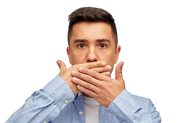 Image showing face of man covering his mouth with hand palm