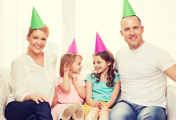 Image showing happy family with two kids in hats celebrating