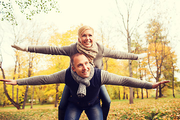 Image showing smiling couple having fun in autumn park