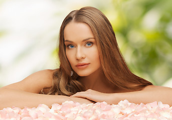 Image showing woman with rose petals and long hair
