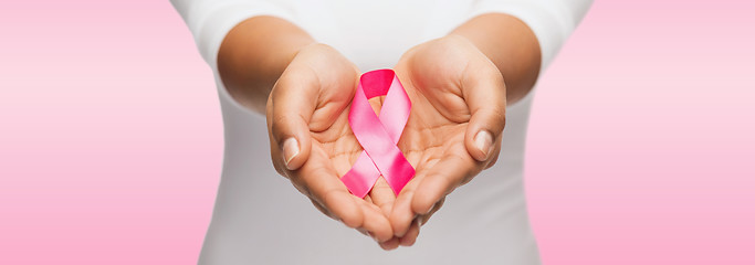 Image showing hands holding pink breast cancer awareness ribbon
