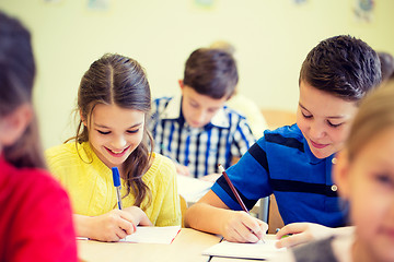 Image showing group of school kids writing test in classroom