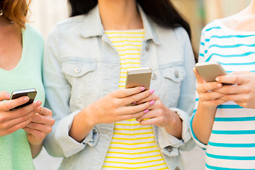 Image showing close up of young women with smartphone