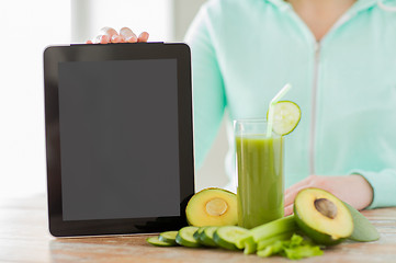 Image showing close up of woman with tablet pc and vegetables