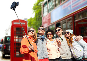 Image showing friends taking selfie with smartphone in london