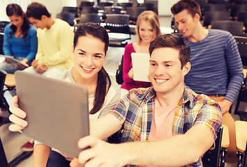 Image showing group of smiling students with tablet pc