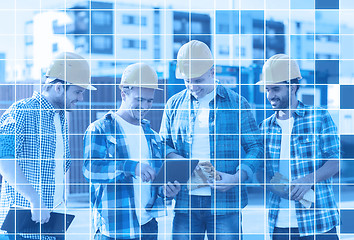 Image showing group of smiling builders with tablet pc outdoors