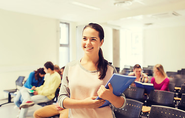 Image showing group of smiling students in lecture hall