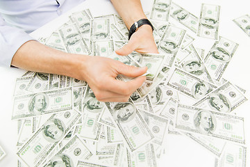 Image showing close up of male businessman hands with money