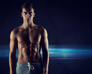 Image showing young male bodybuilder with bare muscular torso