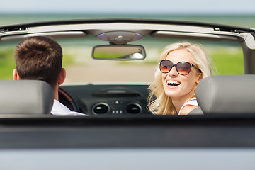 Image showing happy man and woman driving in cabriolet car