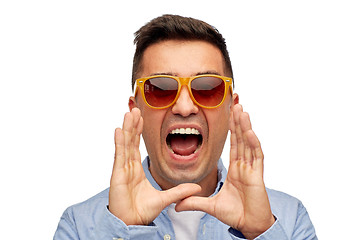 Image showing face of angry shouting man in shirt and sunglasses