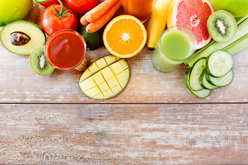 Image showing close up of fresh juice glass and fruits on table