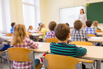 Image showing group of school kids and teacher in classroom