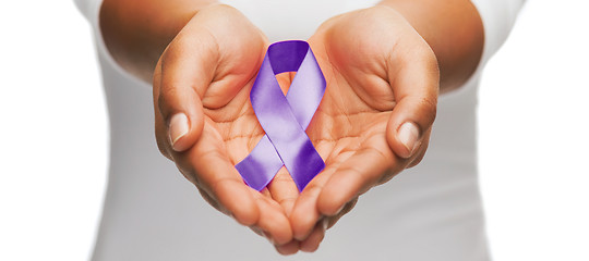 Image showing hands holding purple awareness ribbon