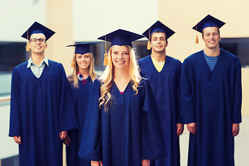 Image showing group of smiling students in mortarboards