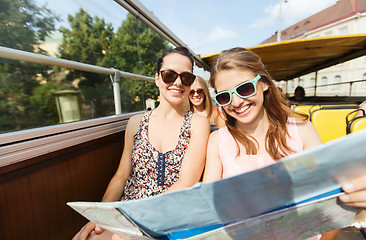 Image showing group of happy friends traveling by tour bus