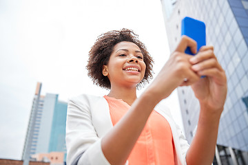 Image showing happy african businesswoman with smartphone