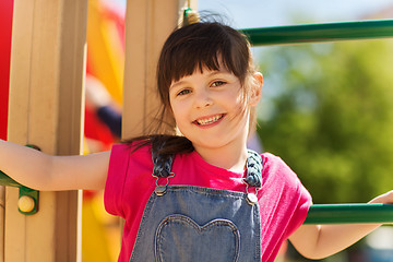 Image showing happy little girl climbing on children playground