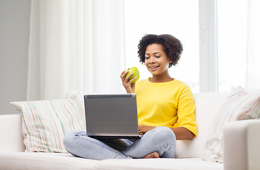 Image showing happy african american woman with laptop at home