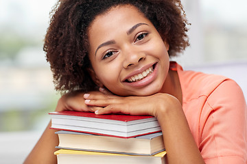 Image showing happy african student girl with books at home