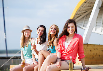 Image showing girls with drinks on the beach