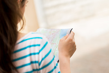 Image showing close up of woman reading map