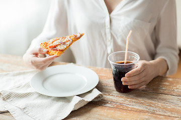 Image showing close up of woman with pizza and cola drink