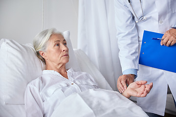 Image showing doctor checking senior woman pulse at hospital