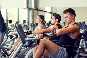 Image showing men working out on exercise bike in gym