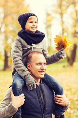 Image showing happy family having fun in autumn park