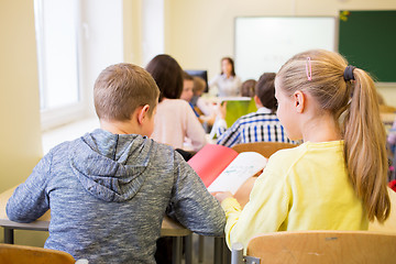 Image showing group of school kids writing test in classroom