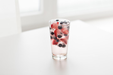 Image showing close up of fruit water with ice cubes in glass