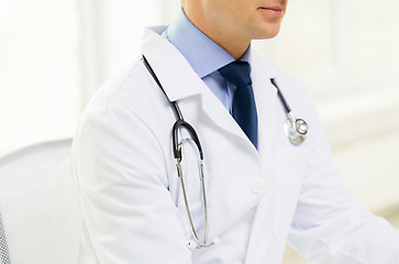 Image showing close up of male doctor at office in hospital