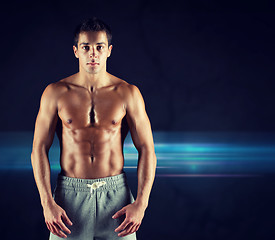 Image showing young male bodybuilder with bare muscular torso