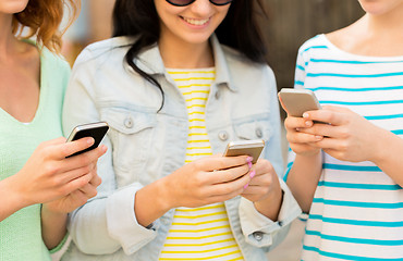 Image showing close up of happy young women with smartphone