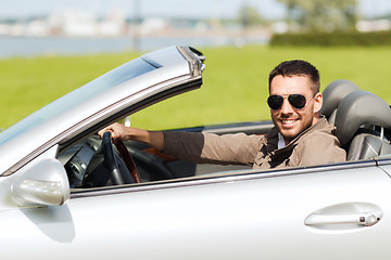 Image showing happy man driving cabriolet car outdoors