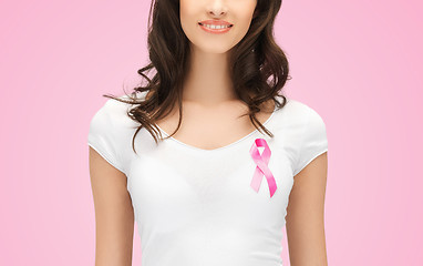 Image showing smiling young woman with cancer awareness ribbon