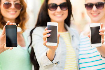 Image showing close up of happy young women with smartphone