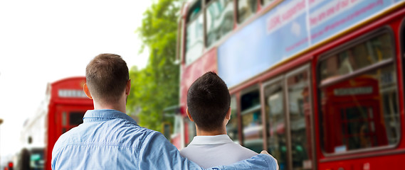 Image showing close up of gay couple hugging over london city