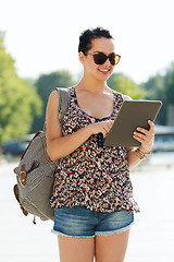 Image showing happy teenage girl with tablet pc and backpack