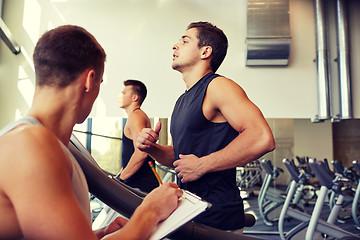 Image showing men exercising on treadmill in gym