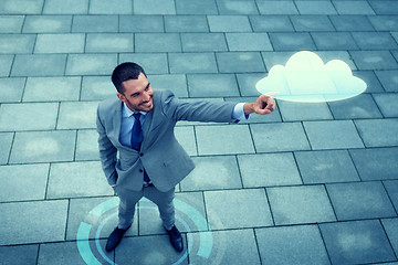 Image showing smiling businessman with cloud projection outdoors