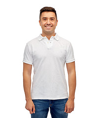 Image showing smiling man in white blank polo t-shirt