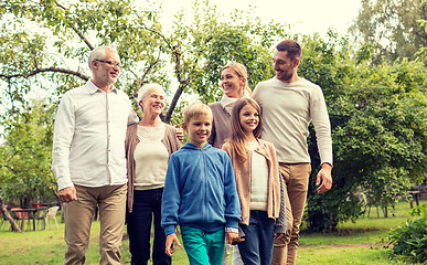 Image showing happy family in front of house outdoors