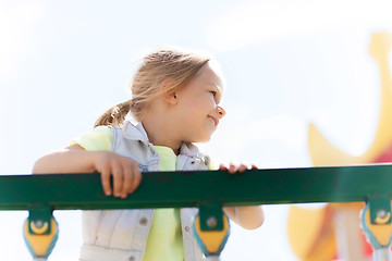 Image showing happy little girl climbing on children playground