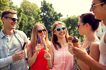 Image showing group of smiling friends with ice cream outdoors