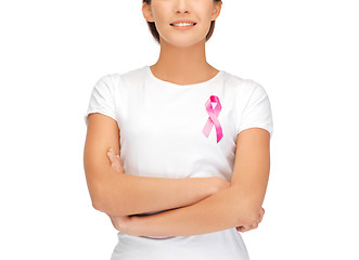 Image showing smiling woman with pink cancer awareness ribbon